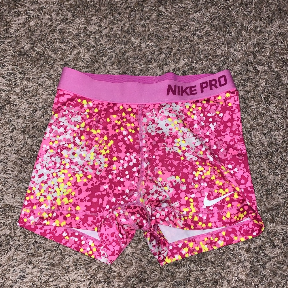Nike Pros in pink and yellow
